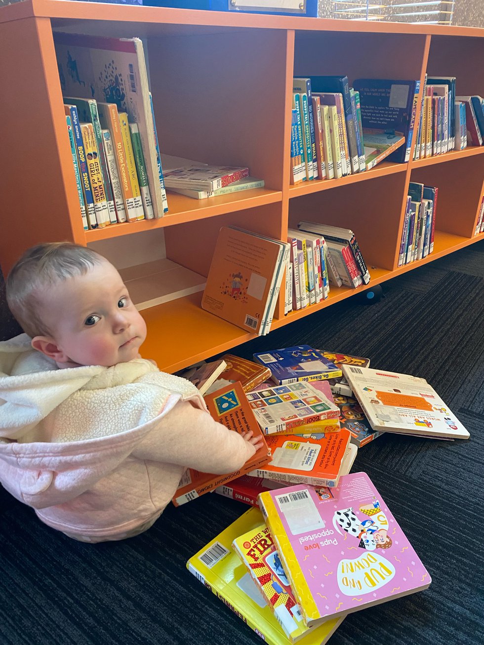 Cole baby with books.jpg