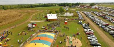 aerial-louisburg-ciderfest-fun-1200x500-91bb39b6.jpeg?ver=1503431009&aspectratio=2.3952095808383.jpe